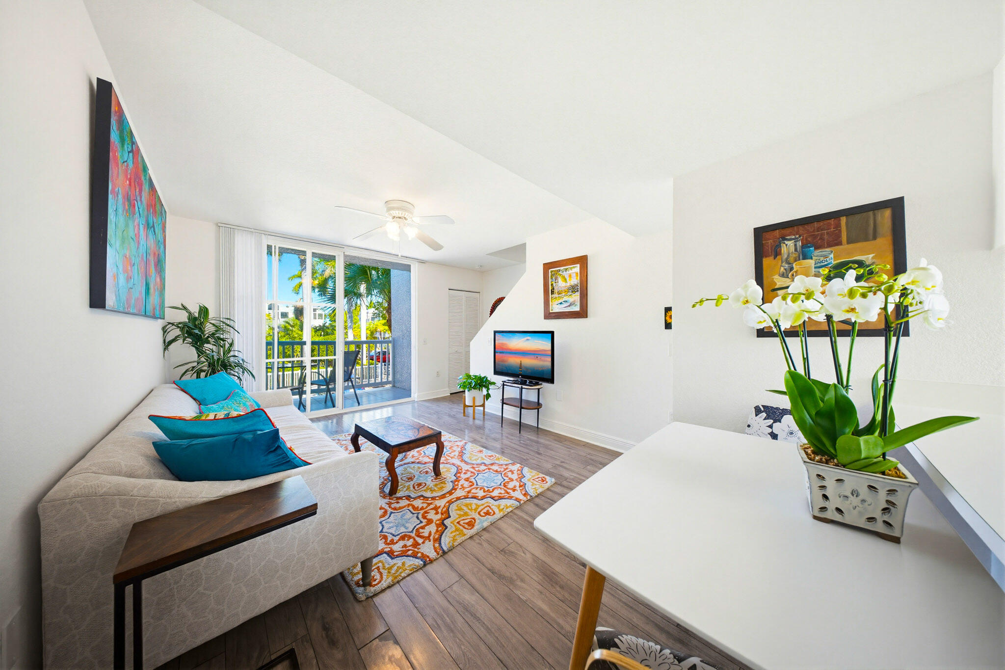 63 Seaside N Court Key West, FL 33040 - Photo 18 of 40 a living room with furniture and a potted plant