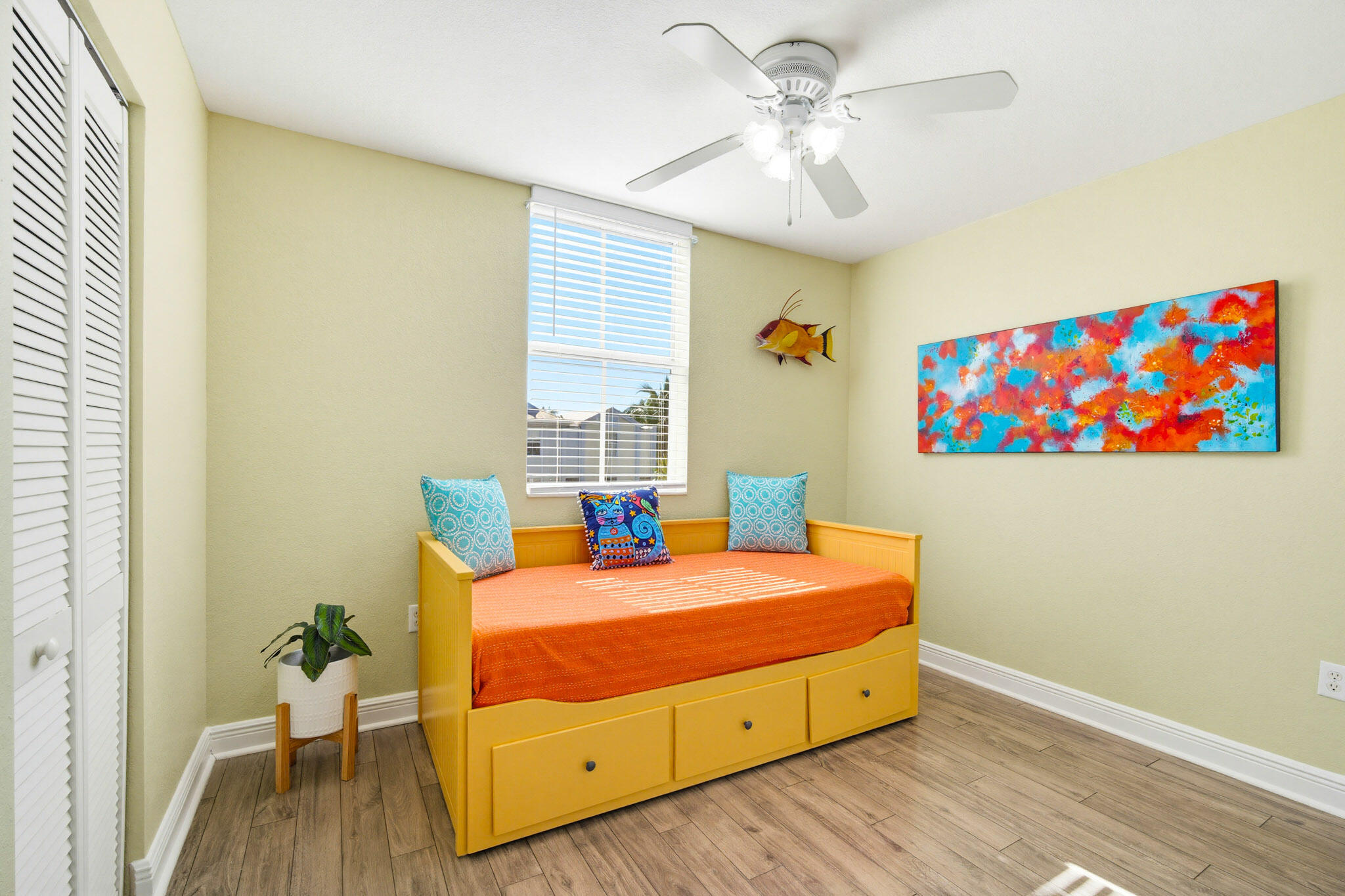 63 Seaside N Court Key West, FL 33040 - Photo 27 of 40 a bedroom with a bed and wooden floor