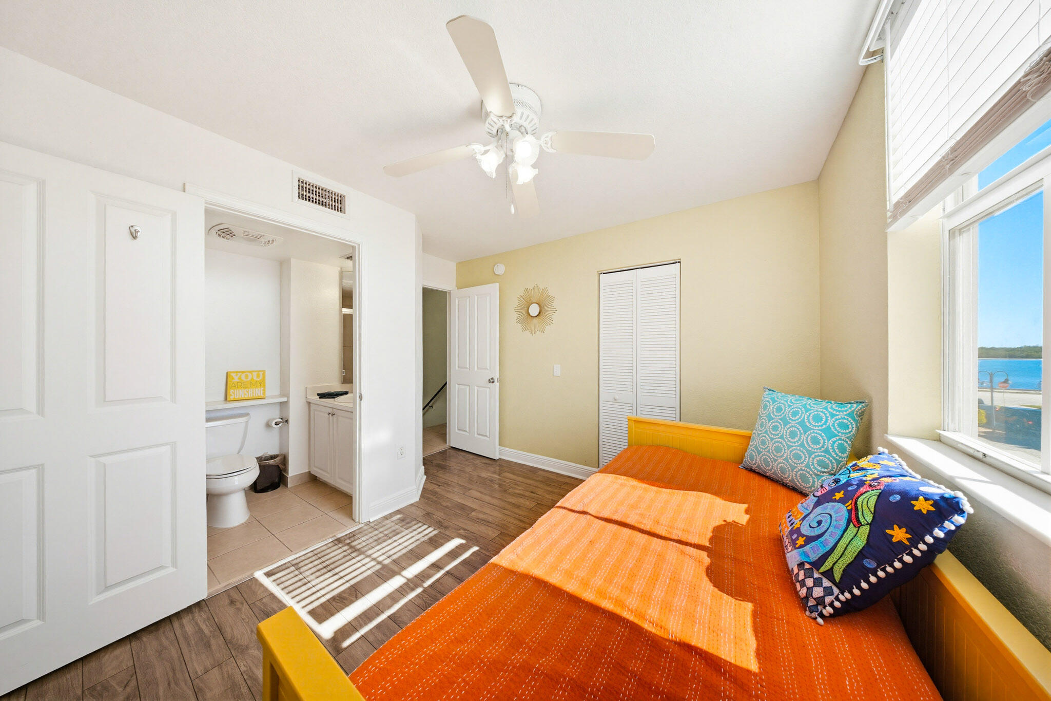 63 Seaside N Court Key West, FL 33040 - Photo 28 of 40 a bedroom with a bed and wooden floor