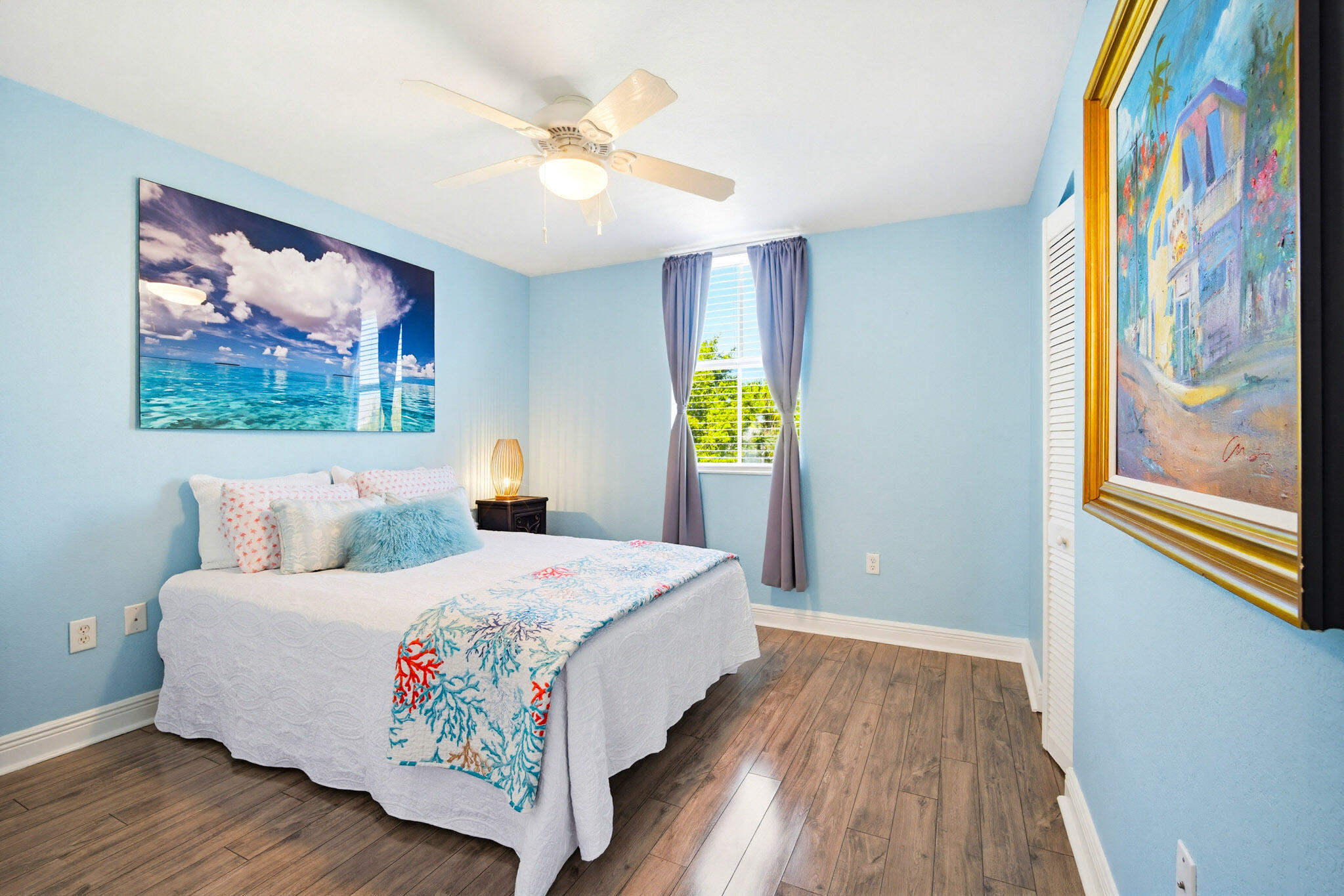 63 Seaside N Court Key West, FL 33040 - Photo 31 of 40 a bedroom with a bed and a painting on the wall