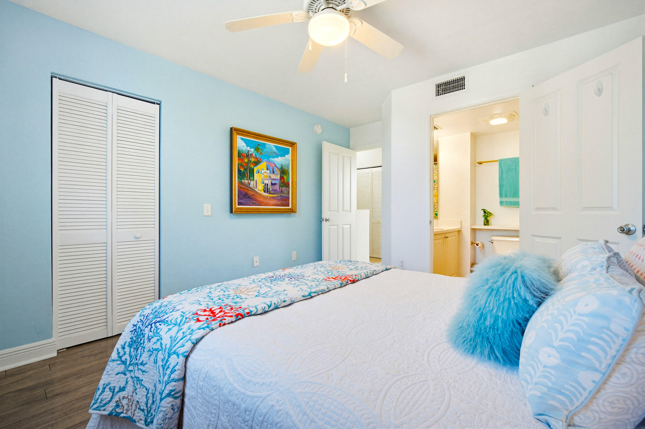 63 Seaside N Court Key West, FL 33040 - Photo 33 of 40 a bedroom with a bed and a chandelier