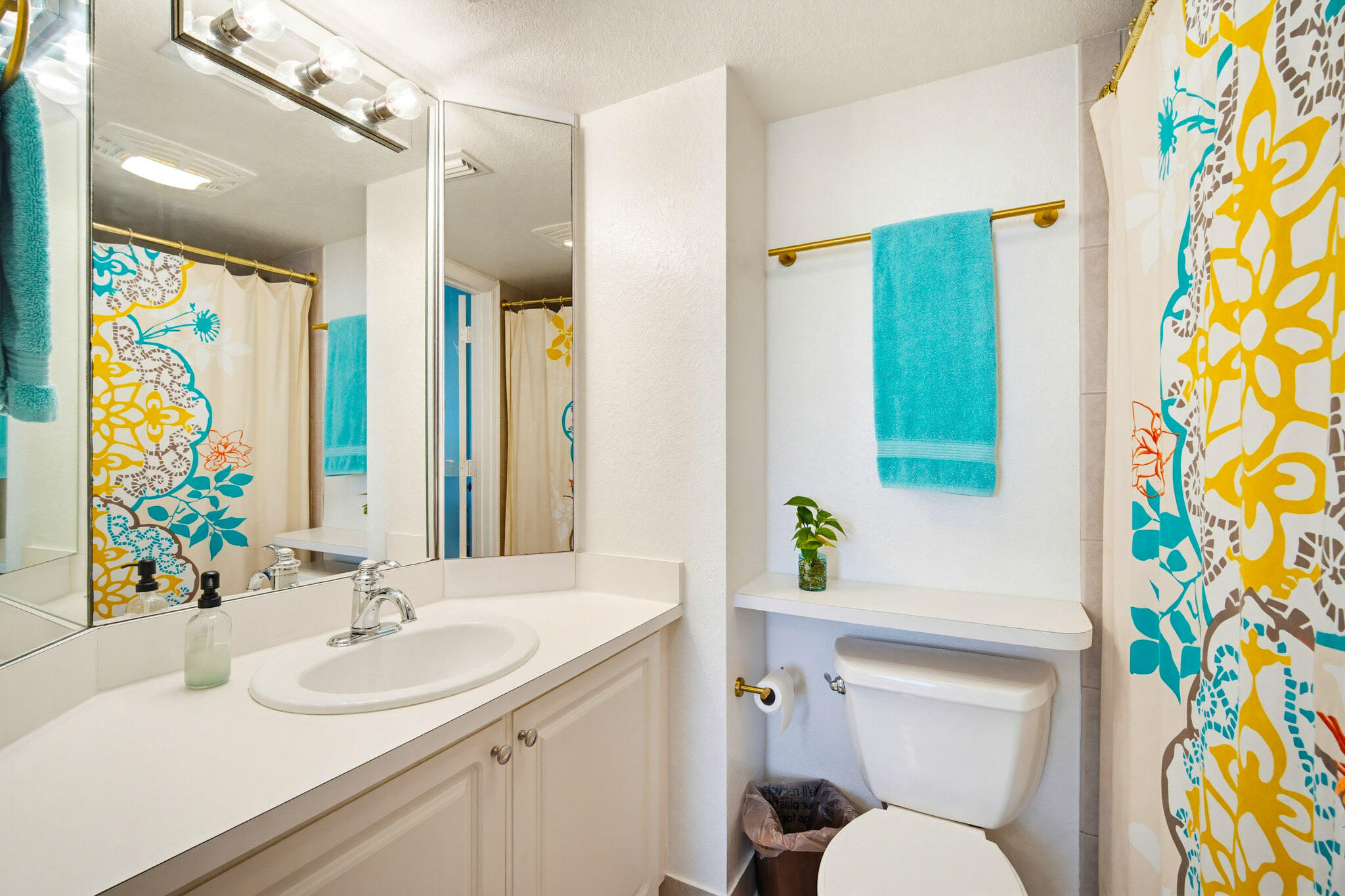 63 Seaside N Court Key West, FL 33040 - Photo 34 of 40 a bathroom with a sink a toilet and shower curtain