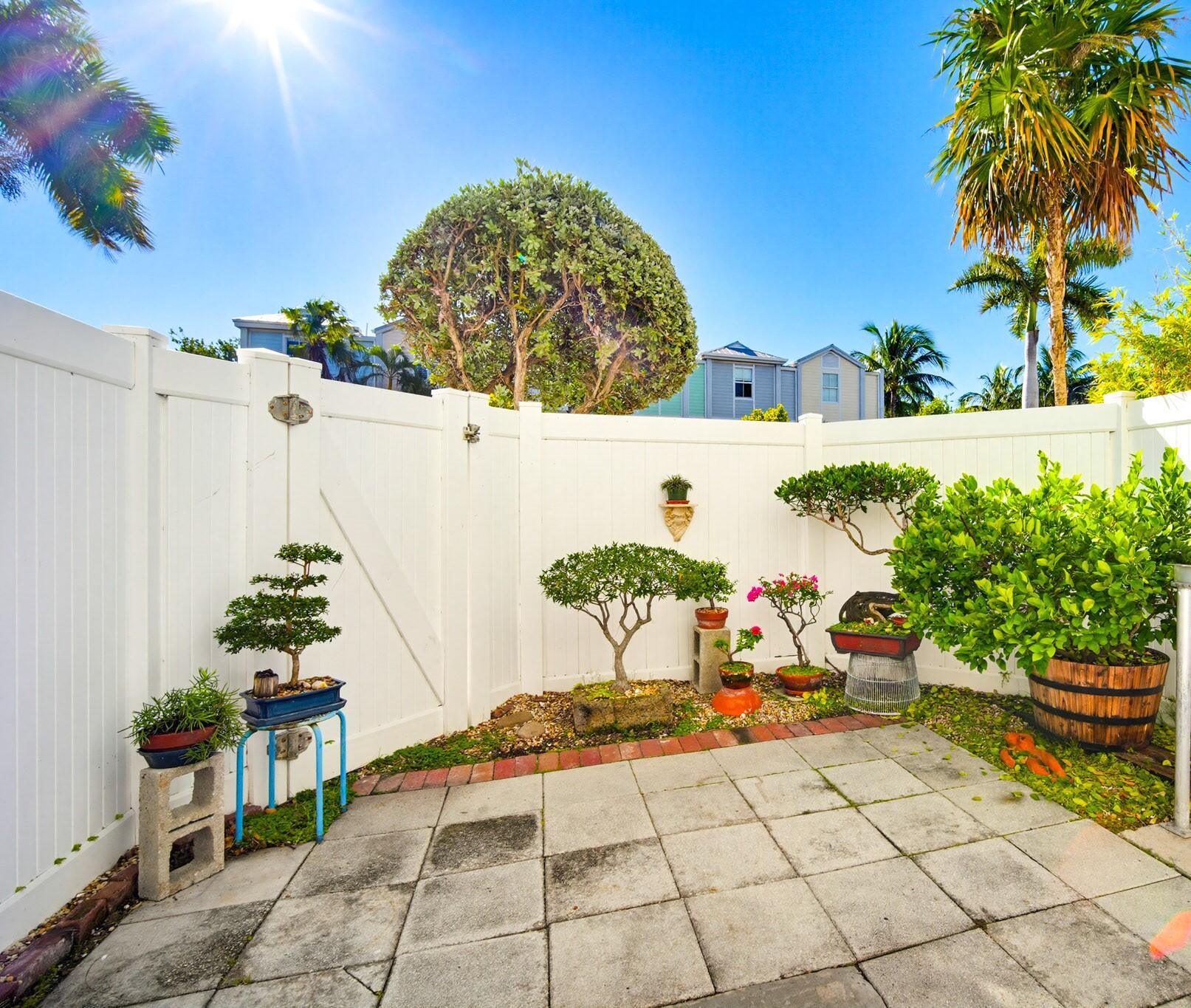 63 Seaside N Court Key West, FL 33040 - Photo 37 of 40 a picture of a table and chairs in patio