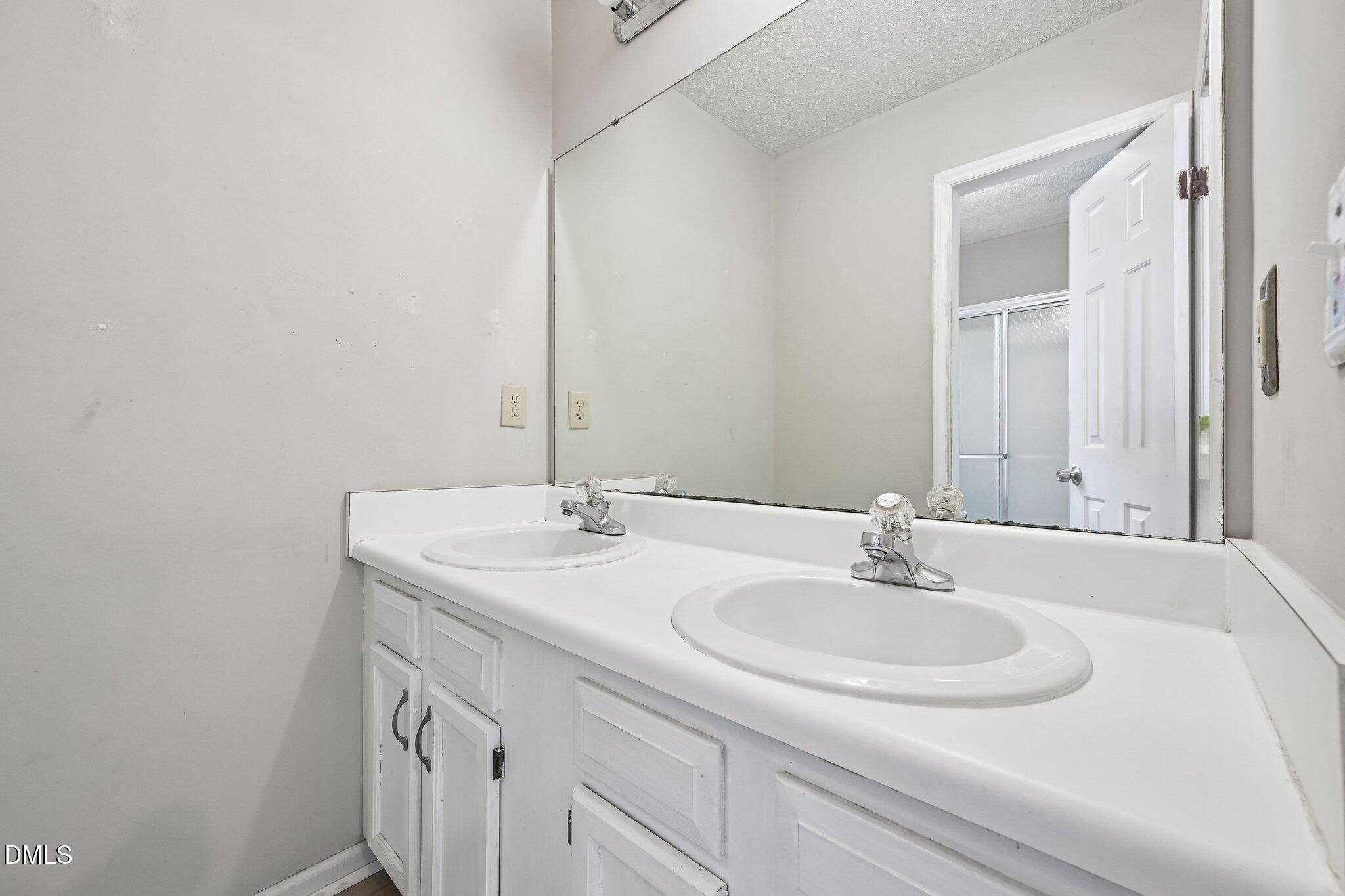 2800 West Jameson Road Raleigh, NC 27604 - Photo 14 of 24 a bathroom with a sink and a mirror