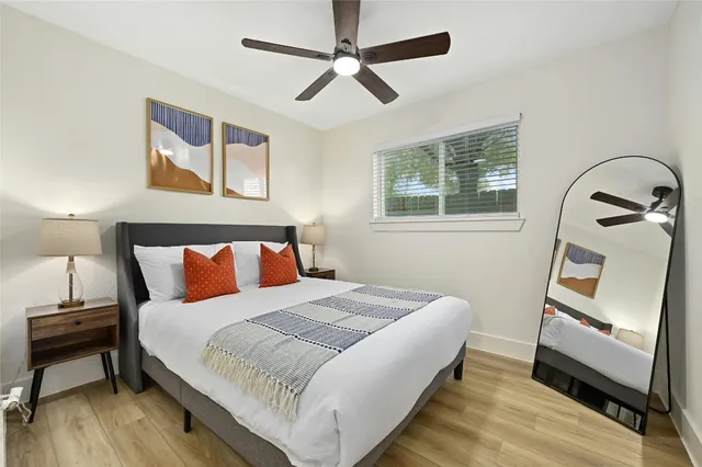 a bedroom with a bed and a dresser