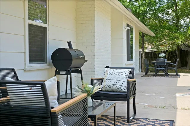 a view of a balcony with chairs