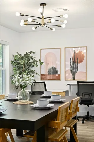 a view of a living room with furniture and window