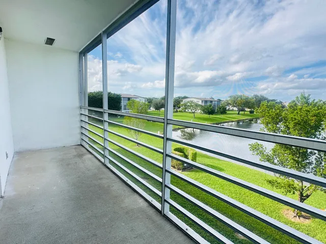 a front view of building with yard