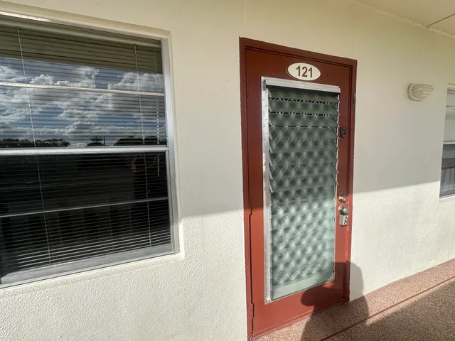 a kitchen with stainless steel appliances a white stove top oven and refrigerator