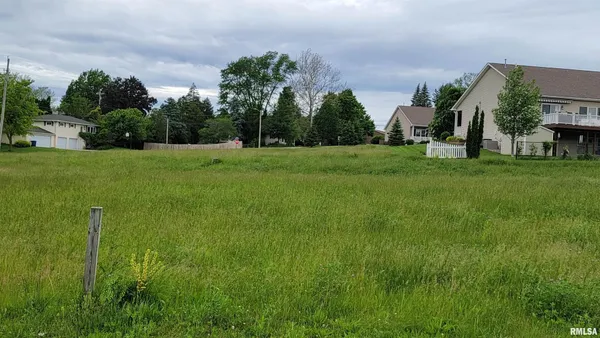 a view of a park with swings and slides
