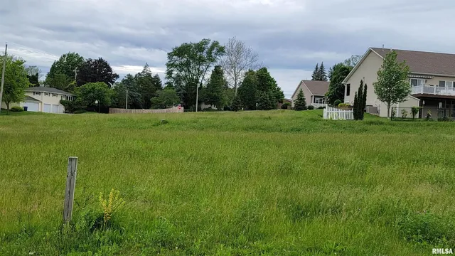 a view of a park with swings and slides