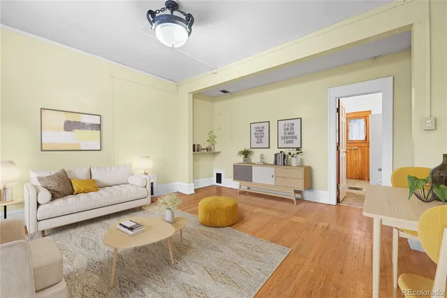a living room with furniture rug and window
