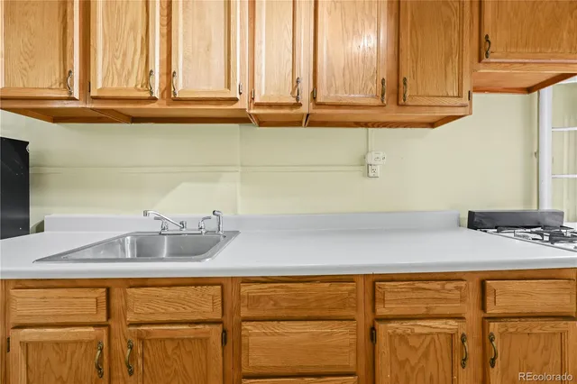 a kitchen with granite countertop cabinets and sink
