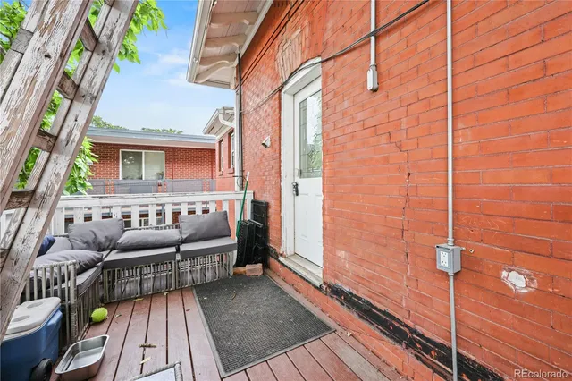 a view of a balcony with furniture