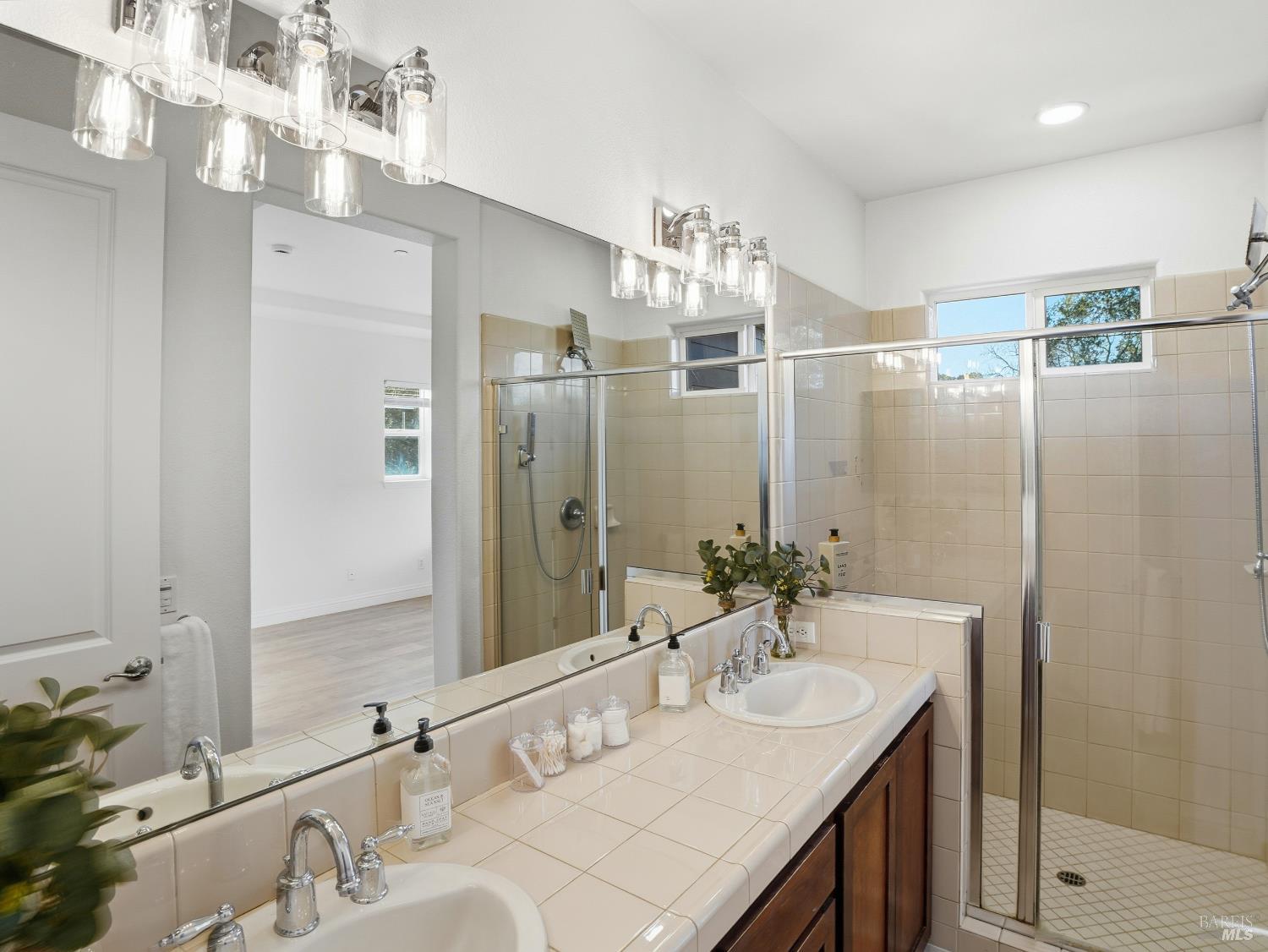 4424 Streamside Drive Santa Rosa, CA 95409 - Photo 42 of 55 a bathroom with a double vanity sink mirror and double