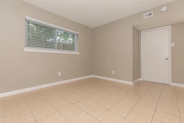 a kitchen with a sink and a refrigerator