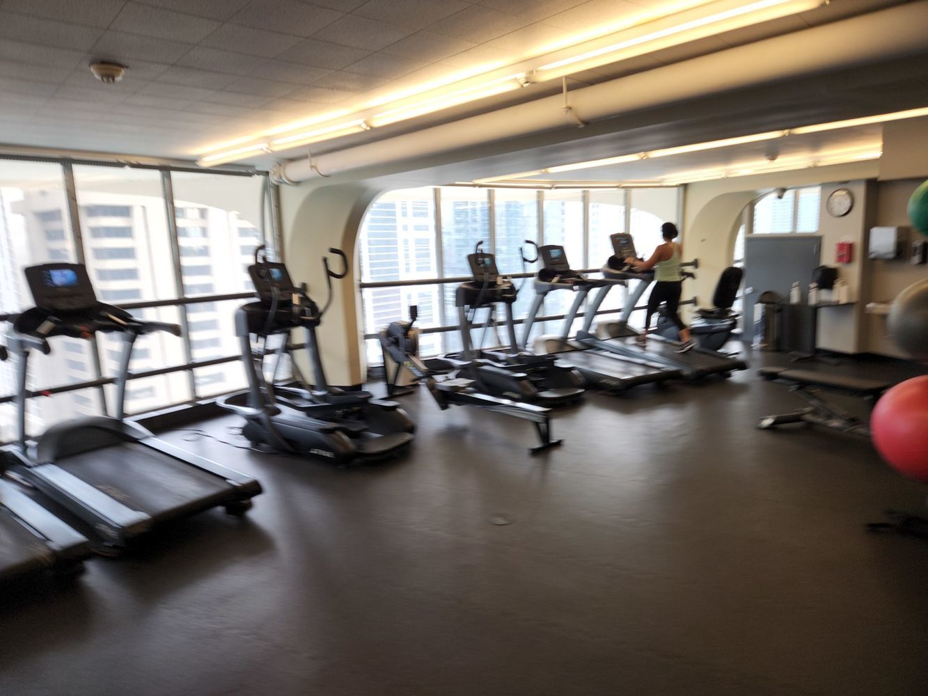 300 North State Street, Unit 3304 Chicago, IL 60654 - Photo 16 of 18 a room with gym equipment and a large window