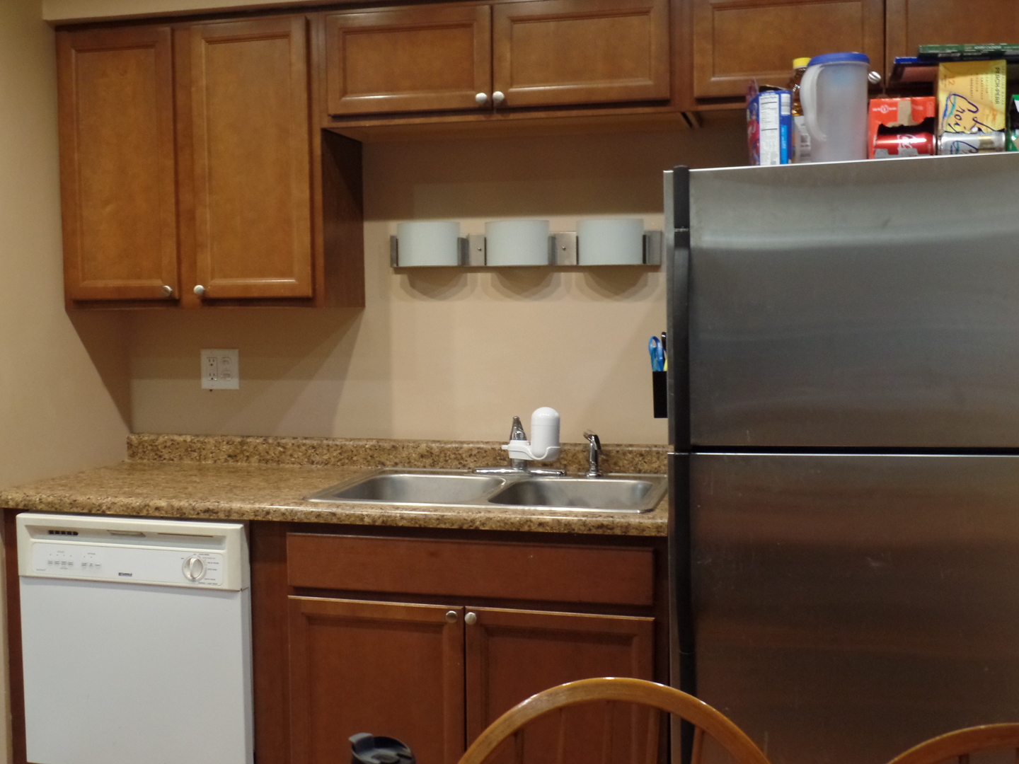 484 Rockhurst Road Bolingbrook, IL 60440 - Photo 12 of 34 a kitchen with a refrigerator and cabinets