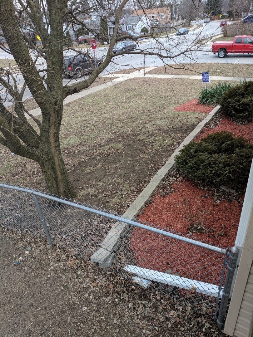 484 Rockhurst Road Bolingbrook, IL 60440 - Photo 29 of 34 a view of a yard with wooden fence