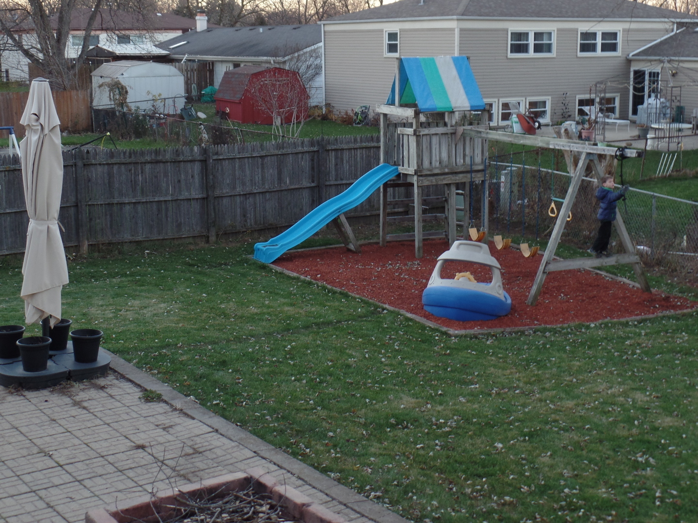 484 Rockhurst Road Bolingbrook, IL 60440 - Photo 31 of 34 a view of a backyard with sitting area and slide