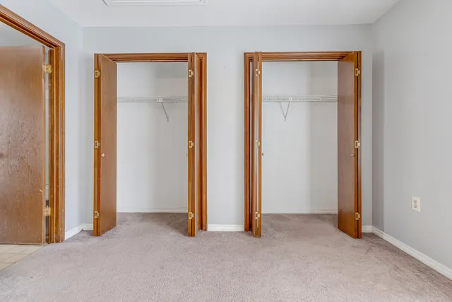 an empty room with closet and closet