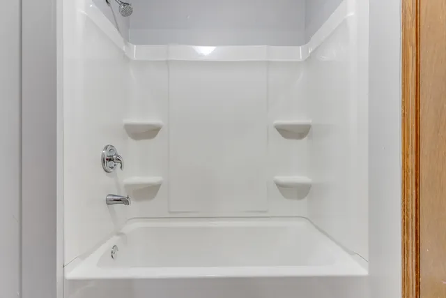 a close up of a bathtub in a bathroom