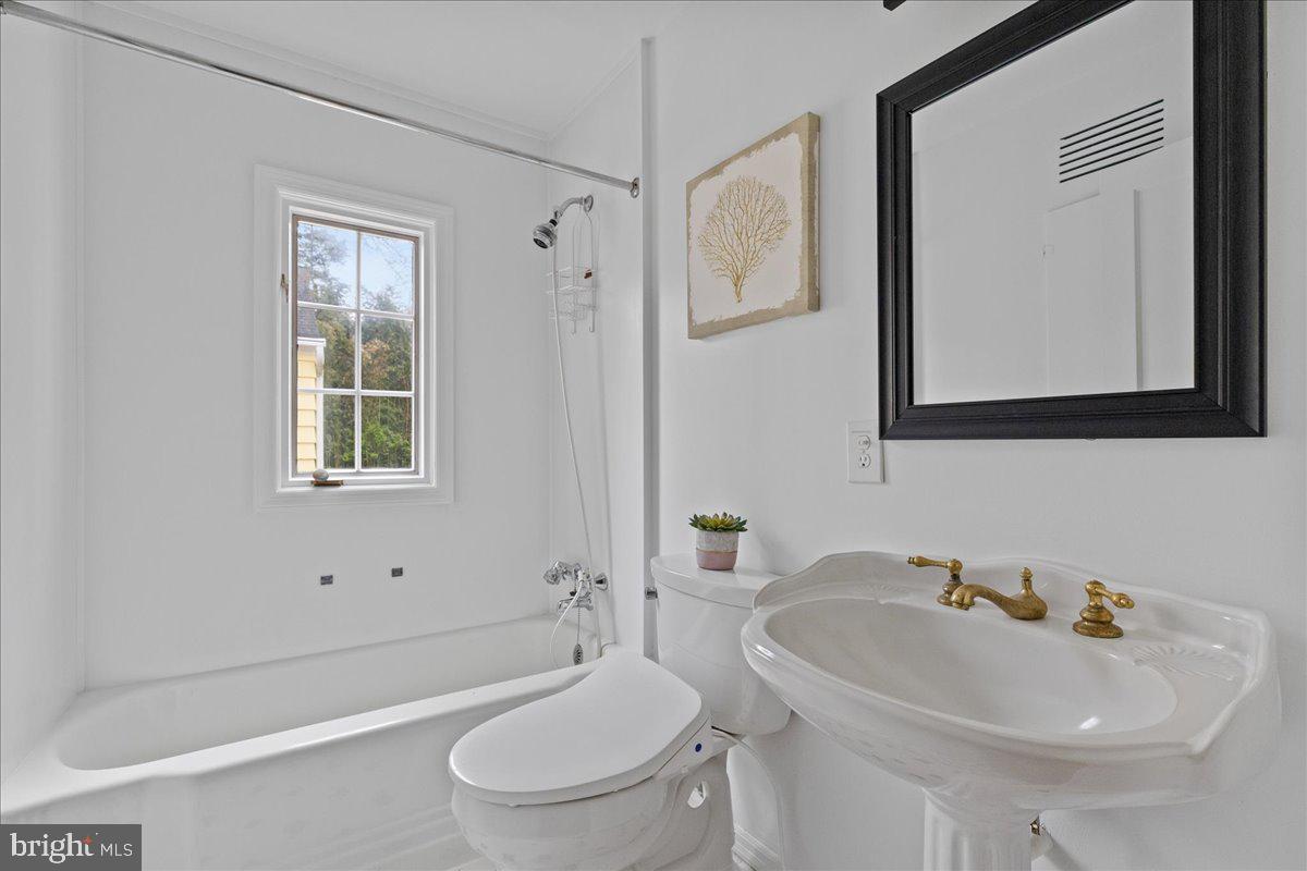 237 Elm Road Princeton, NJ 08540 - Photo 14 of 26 a bathroom with a sink toilet and shower