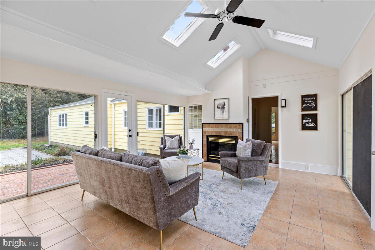 237 Elm Road Princeton, NJ 08540 - Photo 2 of 26 a living room with furniture large window and a fireplace