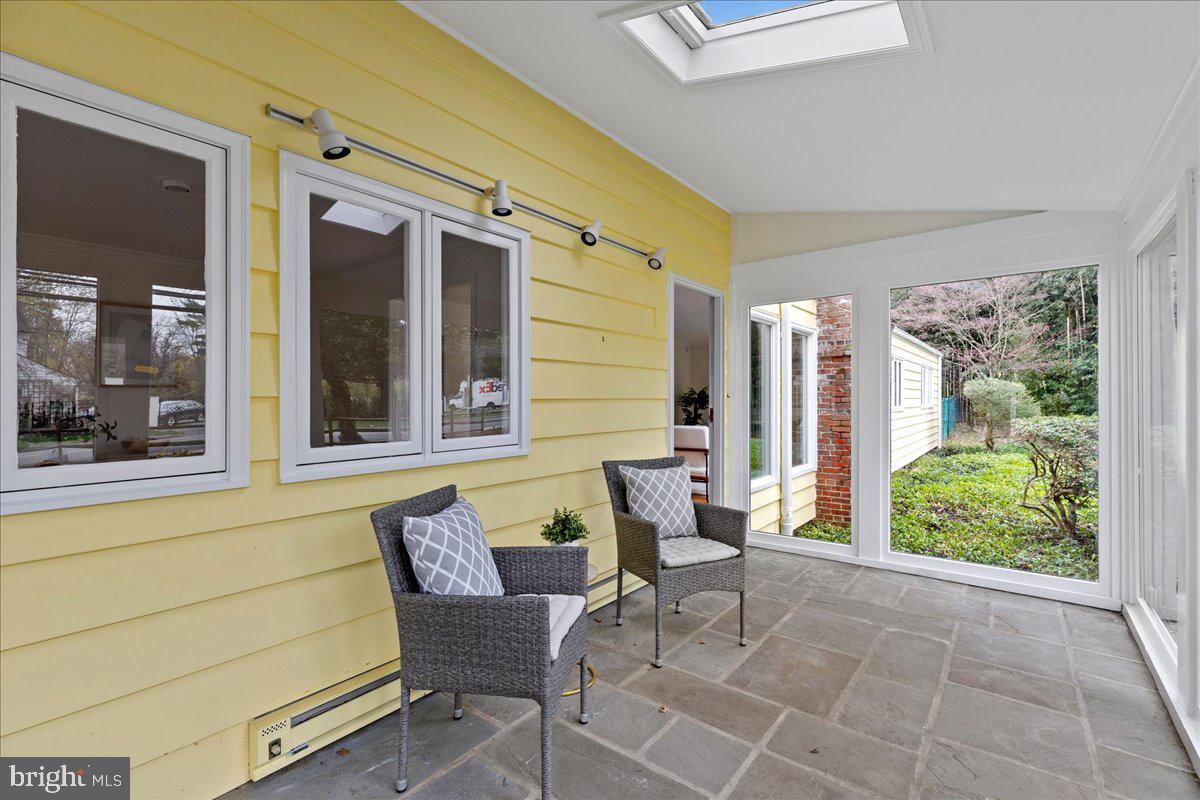 237 Elm Road Princeton, NJ 08540 - Photo 22 of 26 a balcony with couple of chairs and a potted plant