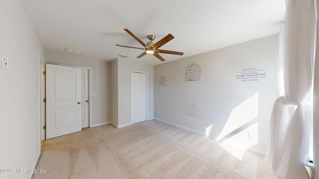 a view of an empty room and window