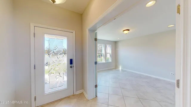 a view of livingroom with hallway and wooden floor