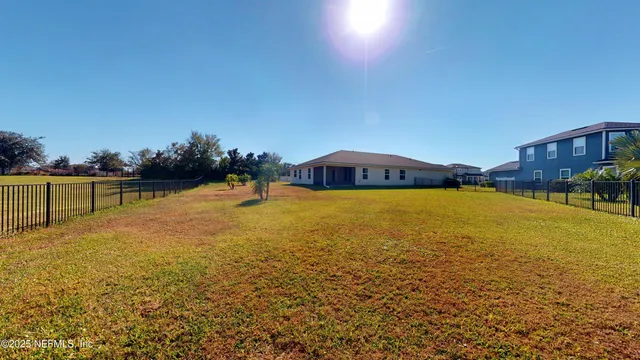a close up of a table with a vase of flowers on it