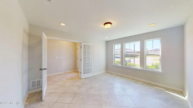 a view of an empty room with a window