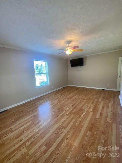 2247 State Rd S-46-149 Clover, SC 29710 - Photo 17 of 35 a view of an empty room with wooden floor and a window
