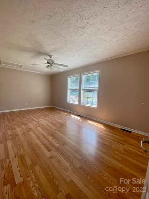 2247 State Rd S-46-149 Clover, SC 29710 - Photo 18 of 35 an empty room with wooden floor and windows