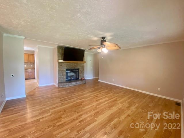 2247 State Rd S-46-149 Clover, SC 29710 - Photo 8 of 35 a view of empty room with fireplace and wooden floor