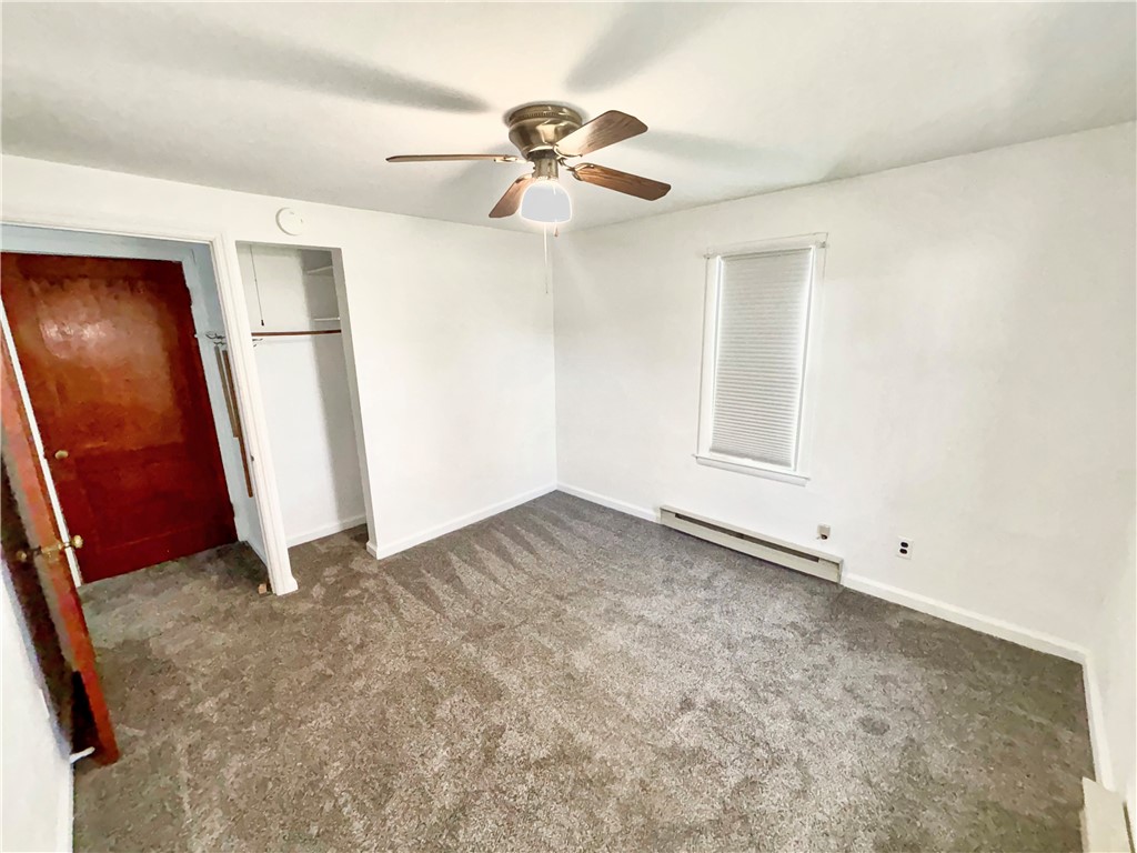 8411 Pitsburg-Laura Road Arcanum, OH 45304 - Photo 8 of 16 This spacious room features cozy carpeting and an integrated closet for seamless storage.