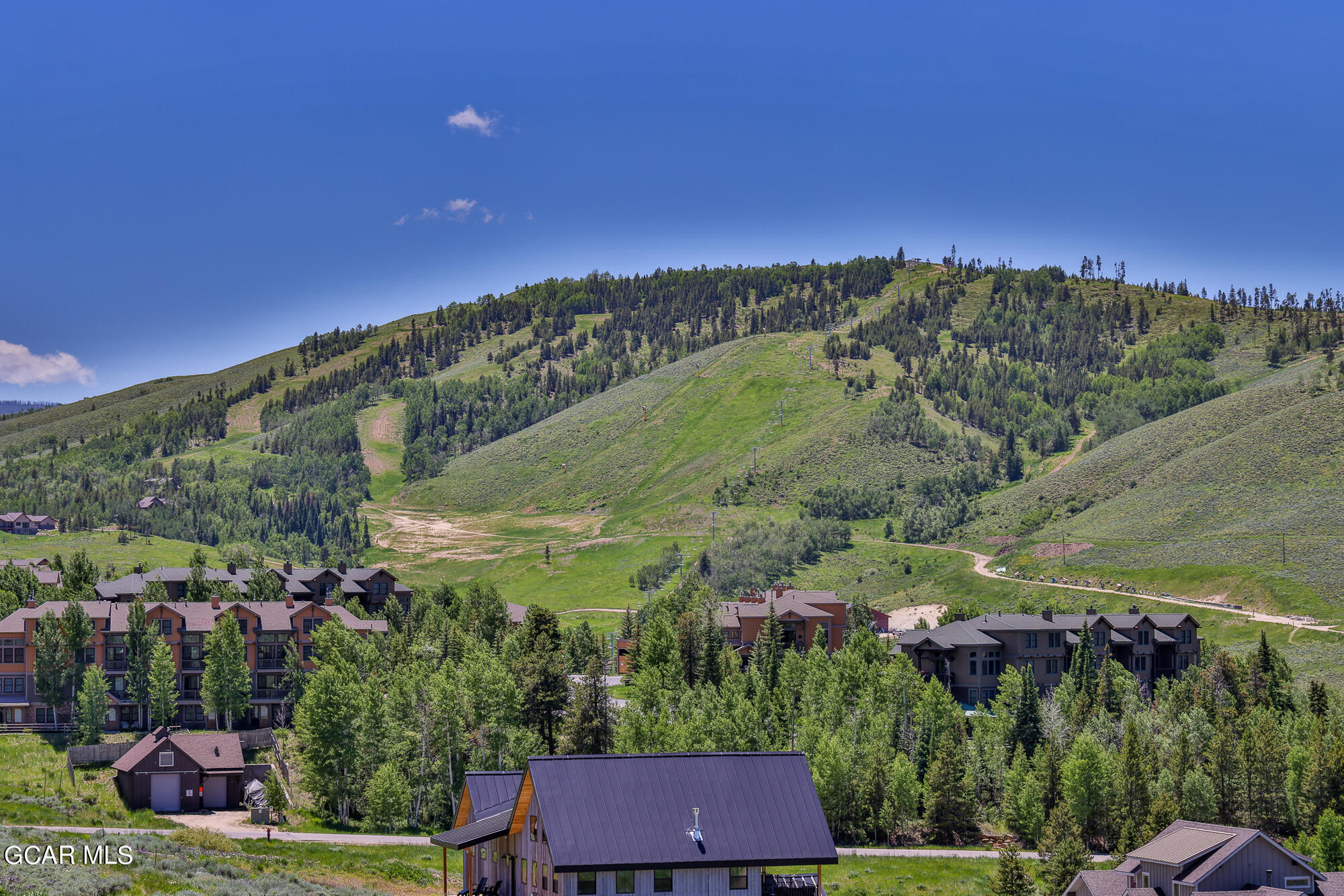 502 Upper Ranch View Drive Granby, CO 80446 - Photo 1 of 40 a view of a city with lush green forest