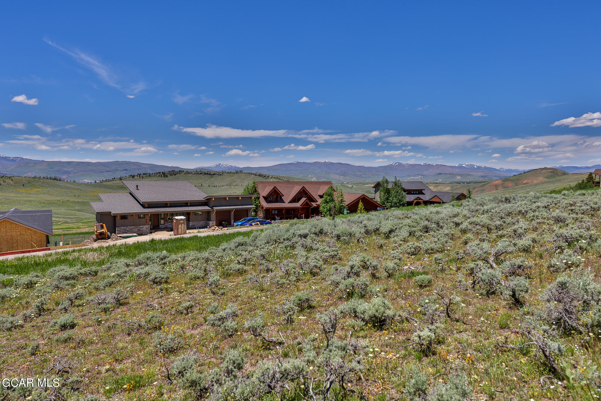 502 Upper Ranch View Drive Granby, CO 80446 - Photo 19 of 40 a view of a backyard with plants and mountain