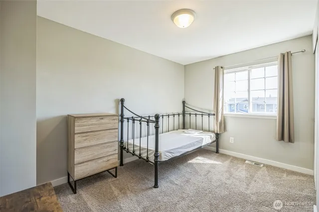 a view of a room with stairs and a window