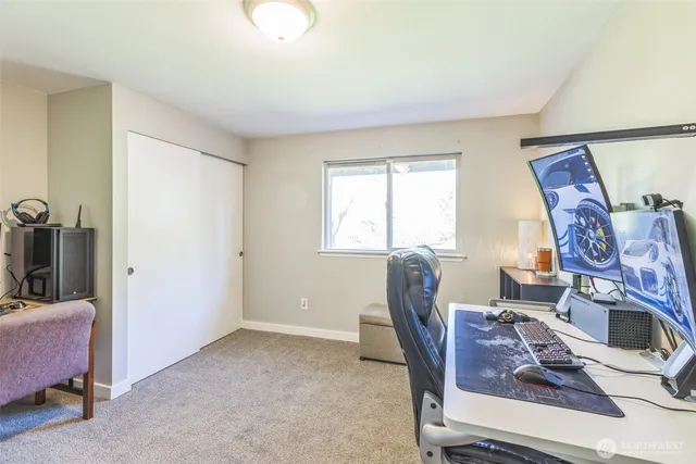 a view of a livingroom with furniture and a window