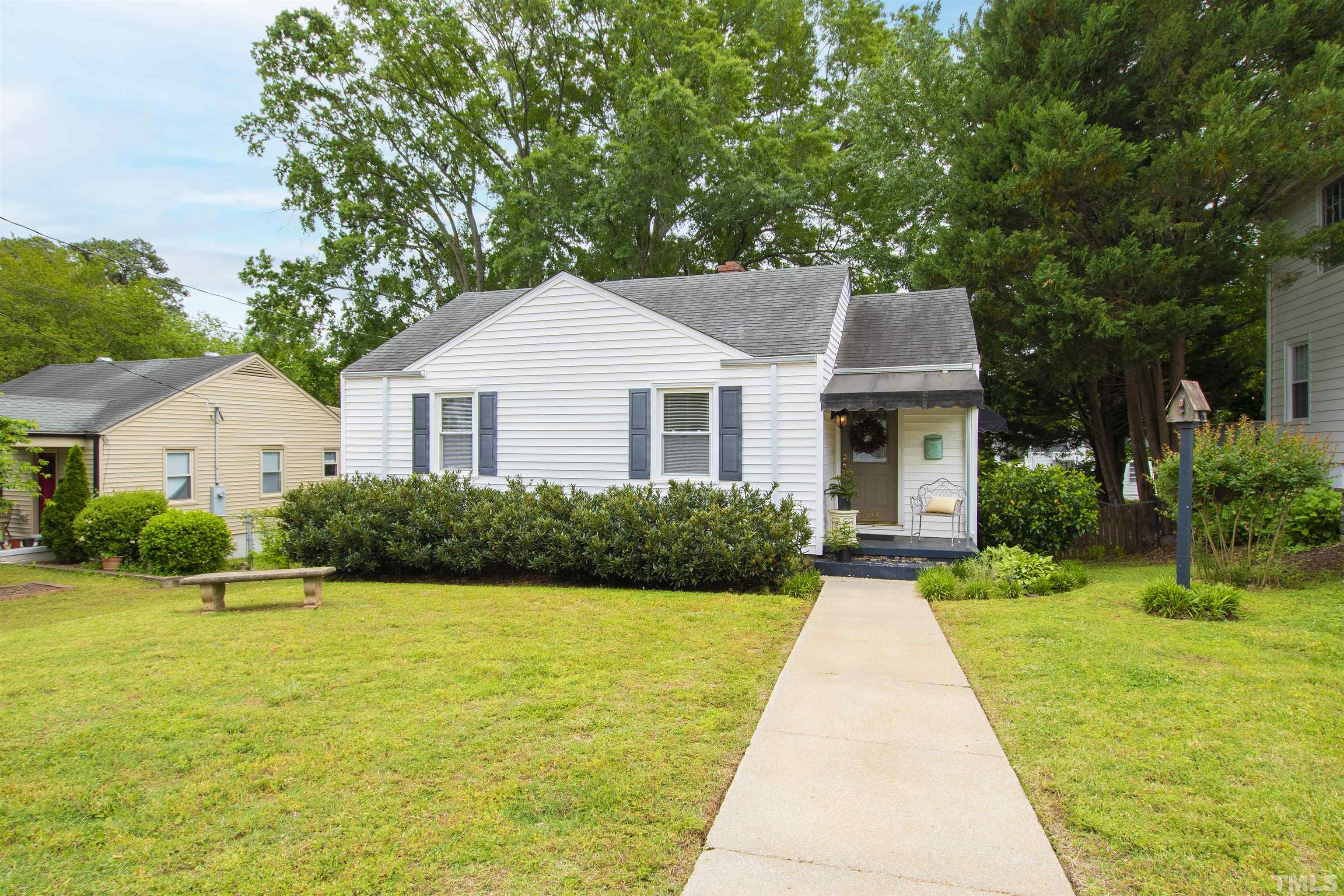602 Harding Street Raleigh, NC 27604 - Photo 1 of 26 a front view of a house with yard and green space