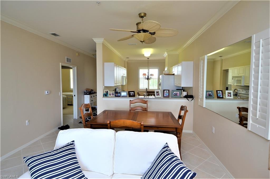 2750 Cypress Trace Circle, Unit 2636 Naples, FL 34119 - Photo 13 of 26 a living room with furniture and a view of kitchen