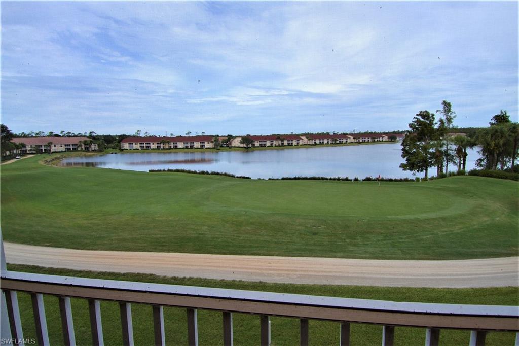 2750 Cypress Trace Circle, Unit 2636 Naples, FL 34119 - Photo 2 of 26 a view of a swimming pool and an ocean view