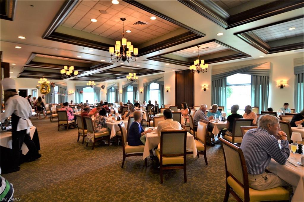 2750 Cypress Trace Circle, Unit 2636 Naples, FL 34119 - Photo 25 of 26 a group of people sitting in a room