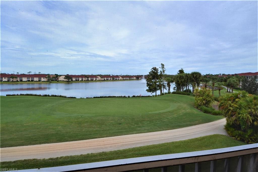2750 Cypress Trace Circle, Unit 2636 Naples, FL 34119 - Photo 3 of 26 a view of a lake with outdoor space and seating area