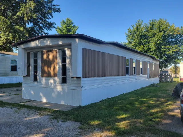 a view of an empty room with a fireplace