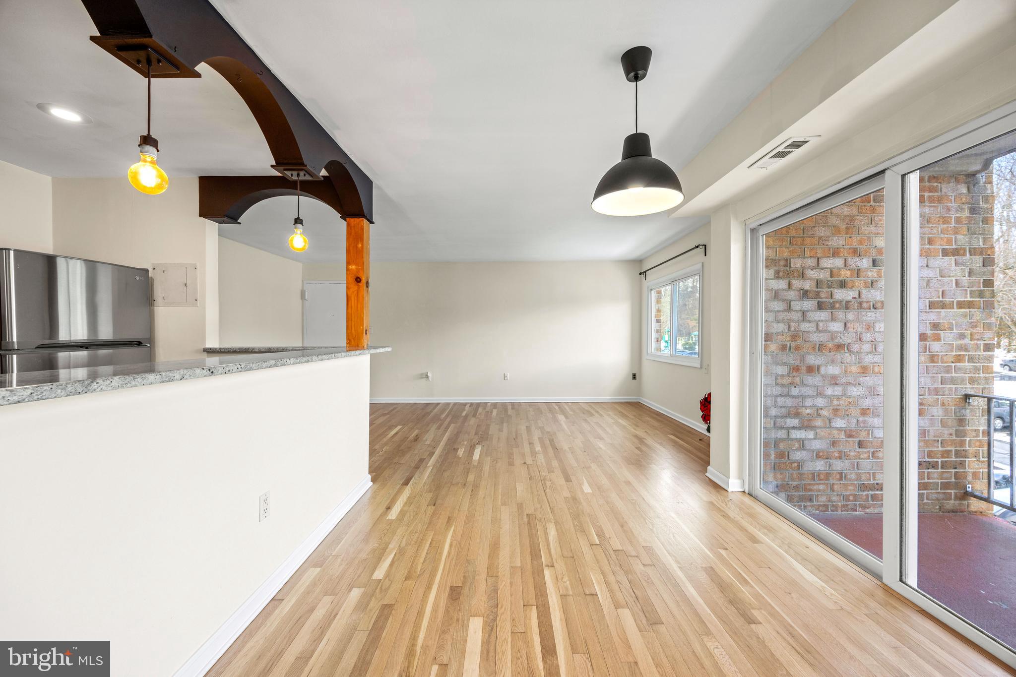 3736 Bel Pre Road, Unit 37367 Silver Spring, MD 20906 - Photo 11 of 27 a view of empty room with wooden floor