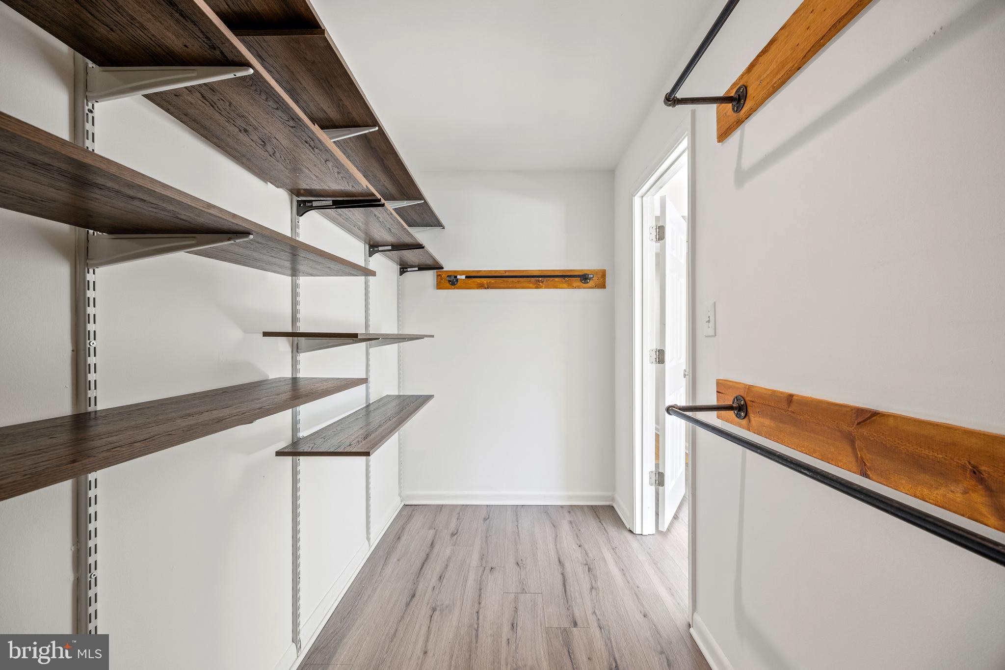 3736 Bel Pre Road, Unit 37367 Silver Spring, MD 20906 - Photo 19 of 27 a view of hallway with stairs and wooden floor