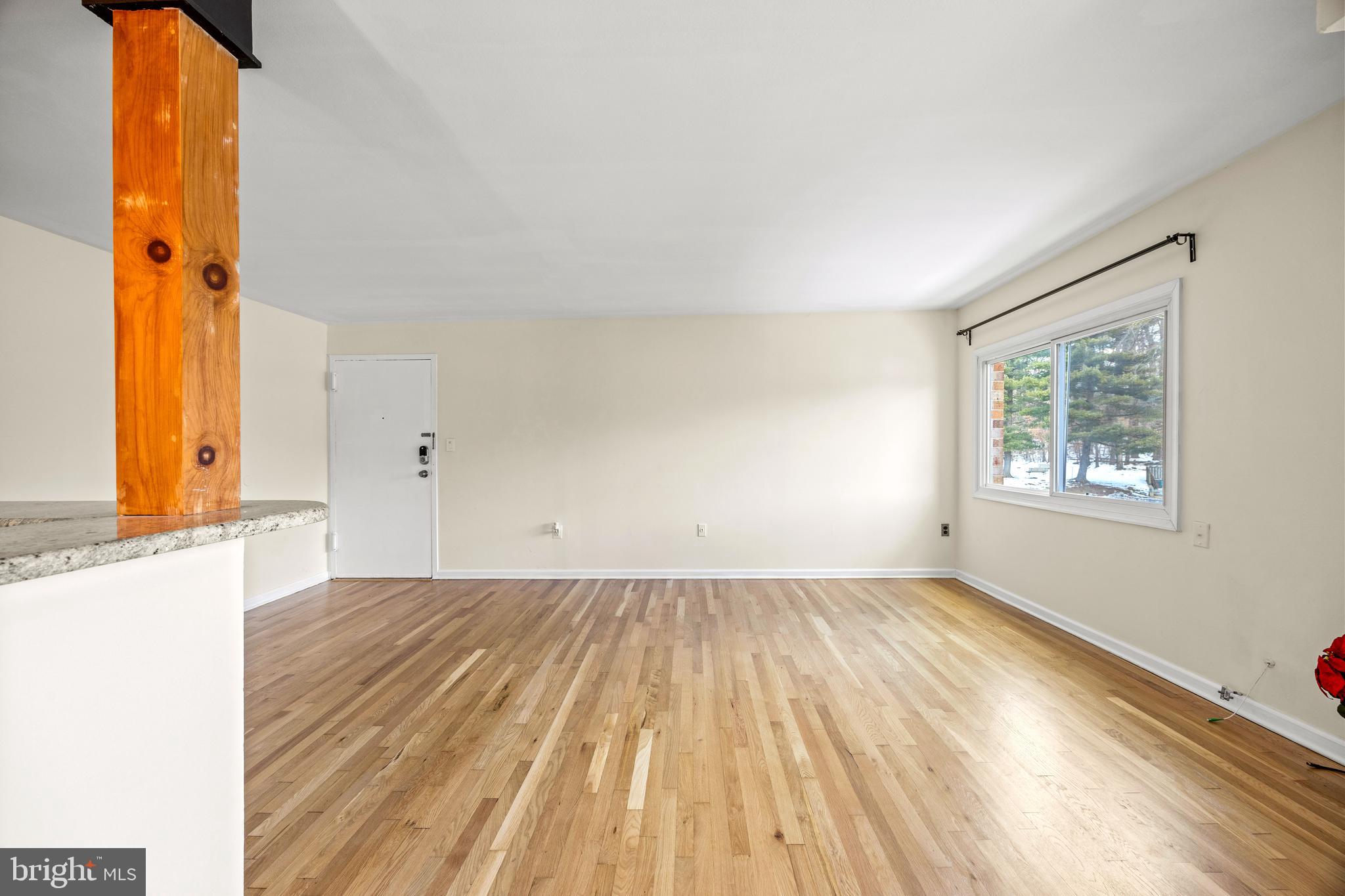 3736 Bel Pre Road, Unit 37367 Silver Spring, MD 20906 - Photo 4 of 27 wooden floor in an empty room with a window